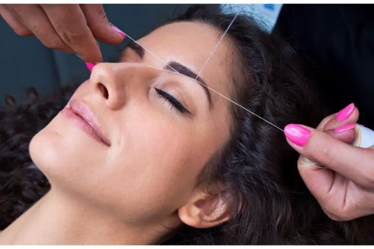 woman on facial hair removal threading procedure